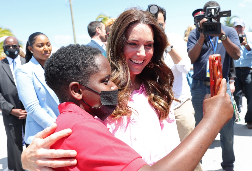 Kate having a selfie taken with a child during a visit to a fish fry in the Abaco Islands in the Bahamas (PA) (PA Archive)