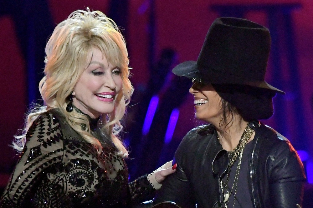 Linda Perry, pictured on stage with Dolly Parton in 2019, is a sought-after songwriter and producer: ‘People come to me for emotion’ (Getty)