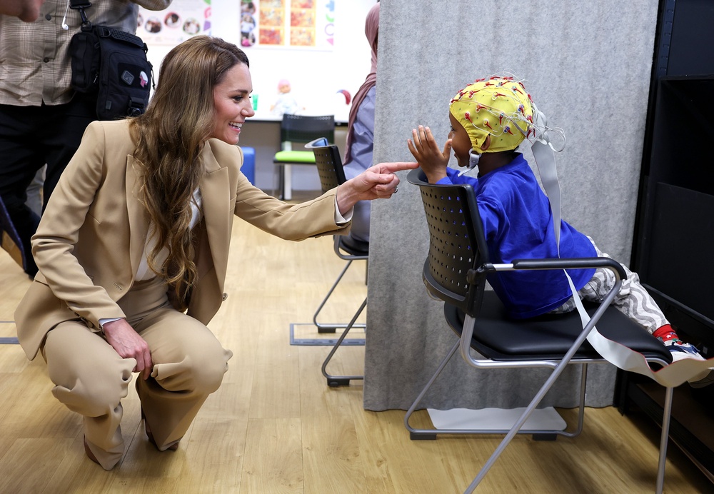 Kate chats to Mikail who was taking part in research at the university’s Institute for the Science of Early Years and Youth (Chris Jackson/PA) (PA Wire)