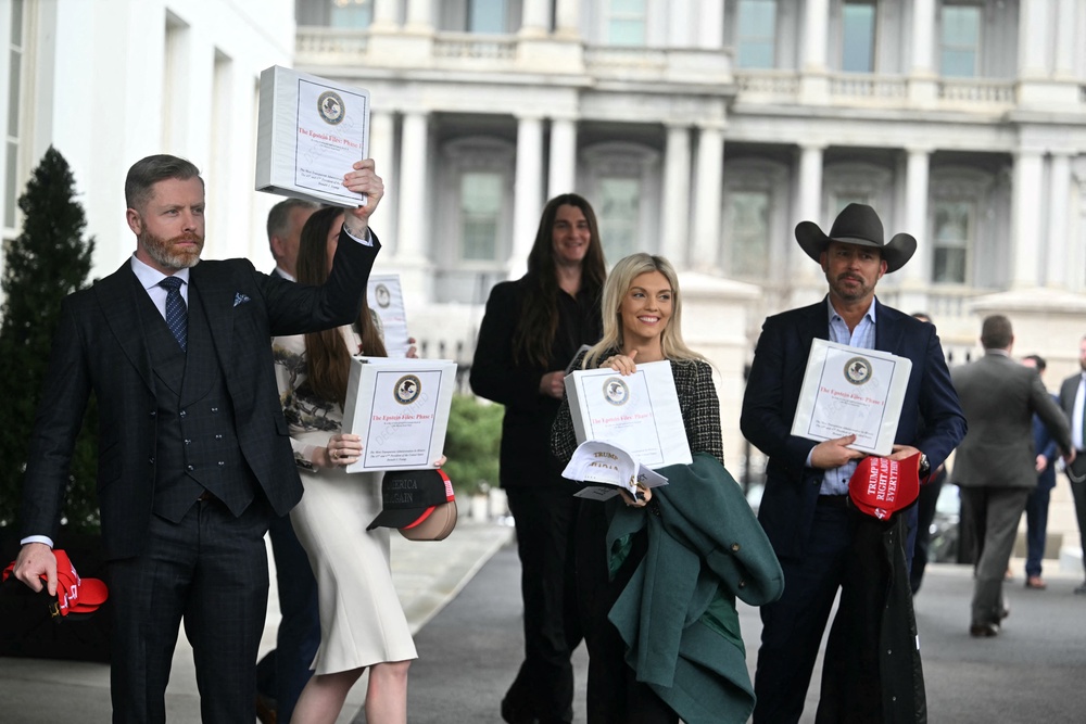In February 2025, 15 right-wing influencers traveled to the White House, where Pam Bondi handed them folders labeled ‘The Epstein Files: Phase 1’ (AFP via Getty Images)