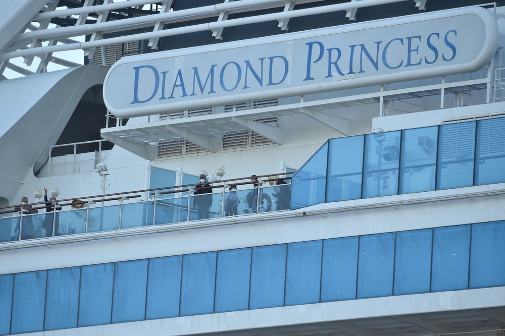 Passengers are seen on the deck of the Diamond Princess cruise ship in February 2020. Hundreds contracted Covid while on the ship, including more than 100 U.S. passengers (AFP/Getty)