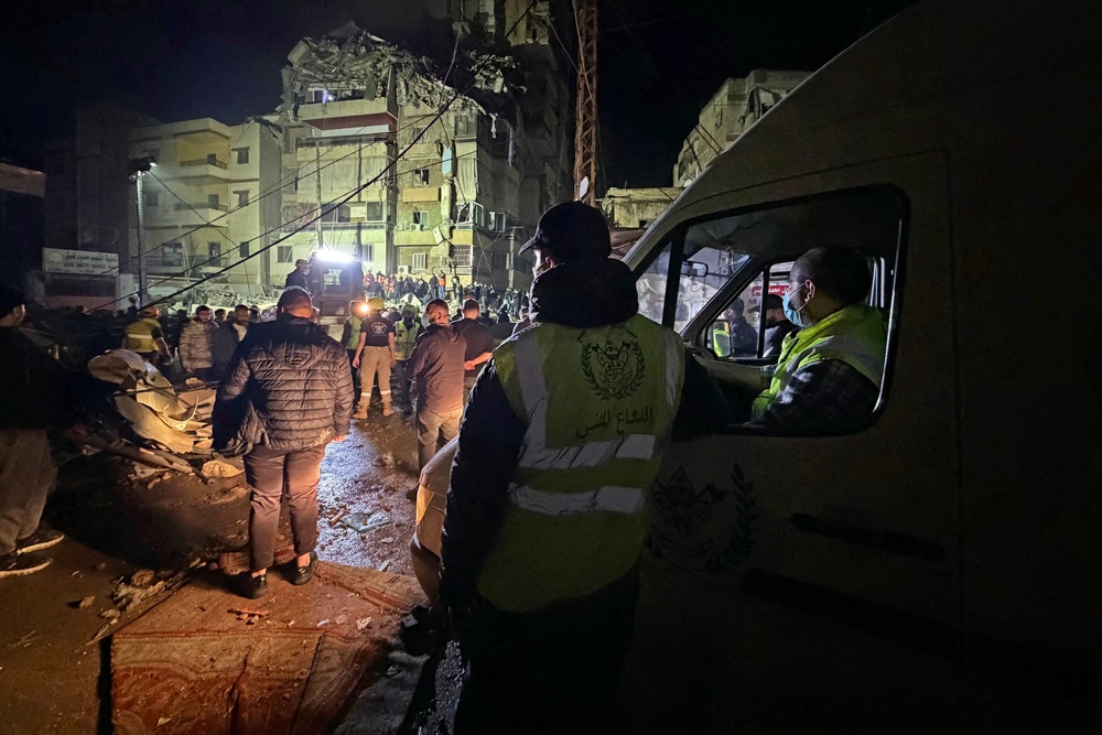 People gather at the site of an Israeli airstrike that targeted Beirut's southern suburbs of Haret Hreik neighborhood (AFP/Getty)