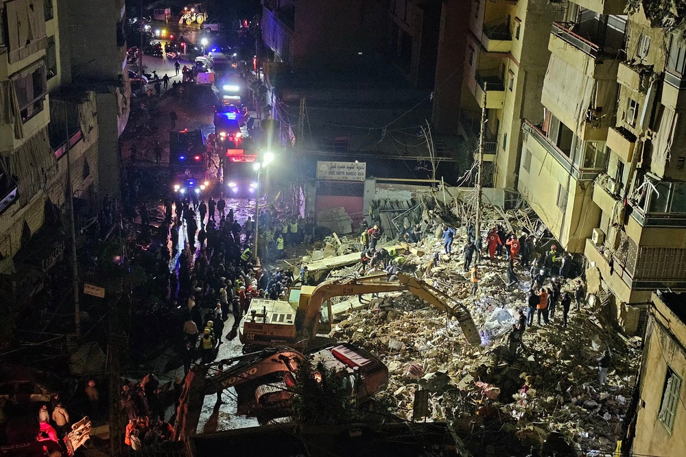 First responders gather at the site of an Israeli airstrike in Beirut's southern suburb of Haret Hreik neighborhood (AFP/Getty)