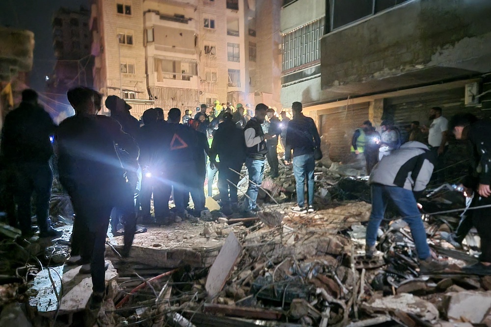 People gather at the site of an Israeli airstrike that targeted Beirut's southern suburbs neighbourhood of Haret Hreik (AFP/Getty)