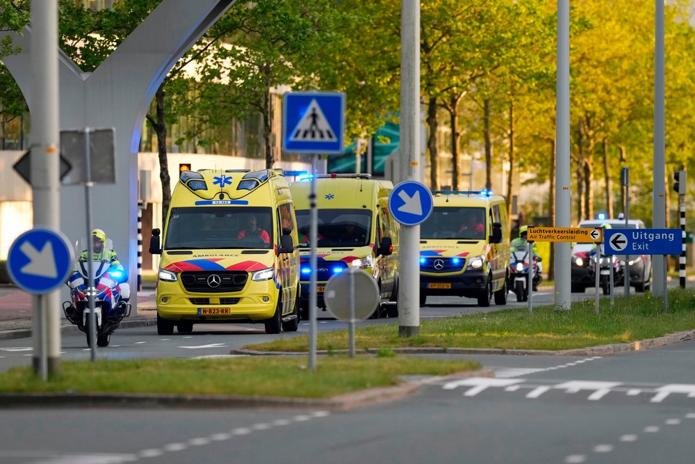 Ambulances in Amsterdam leave with one of three patients evacuated from the MV Hondius on Wednesday (AP)