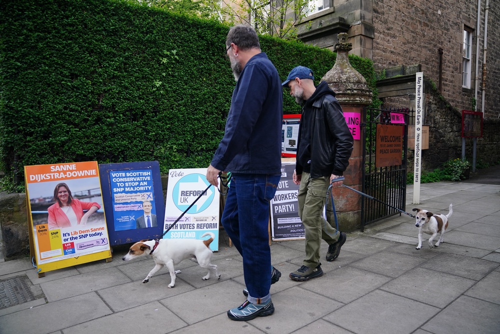 St James’ Church became puppy central as voters brought their four-legged friends along for the day (PA)