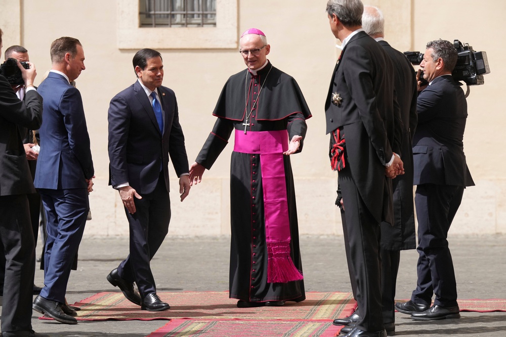 Prefect of the Papal Household Archbishop Petar Rajic welcomes U.S. Secretary of State Marco Rubio as he arrives at the San Damaso courtyard to meet Pope Leo XIV at the Vatican, May 7 (Reuters)