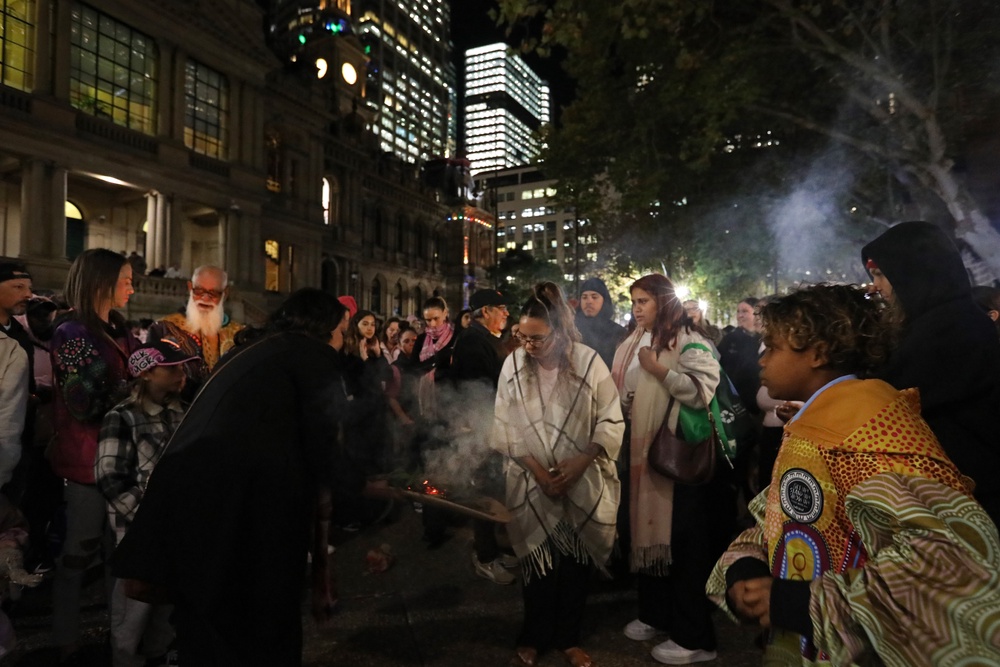 Supporters take part in a traditional smoking ceremony during a candlelight vigil in honour of Kumanjayi Little Baby at Town Hall on 7 May 2026 in Sydney, Australia. The vigils follow days of unrest in Alice Springs, where crowds of more than 100 people rioted outside the hospital treating Jefferson Lewis, 47, who has been charged with the murder of the five-year-old Warlpiri girl after her body was found last Thursday, five days after she was reported missing from Old Timers Camp (Getty)