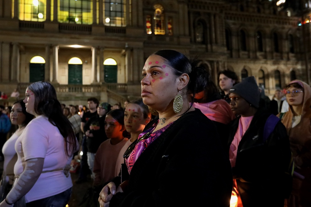 Supporters hold candles as they stand in silence during a vigil in honour of Kumanjayi Little Baby at Town Hall on 7 May 2026 in Sydney, Australia (Getty)