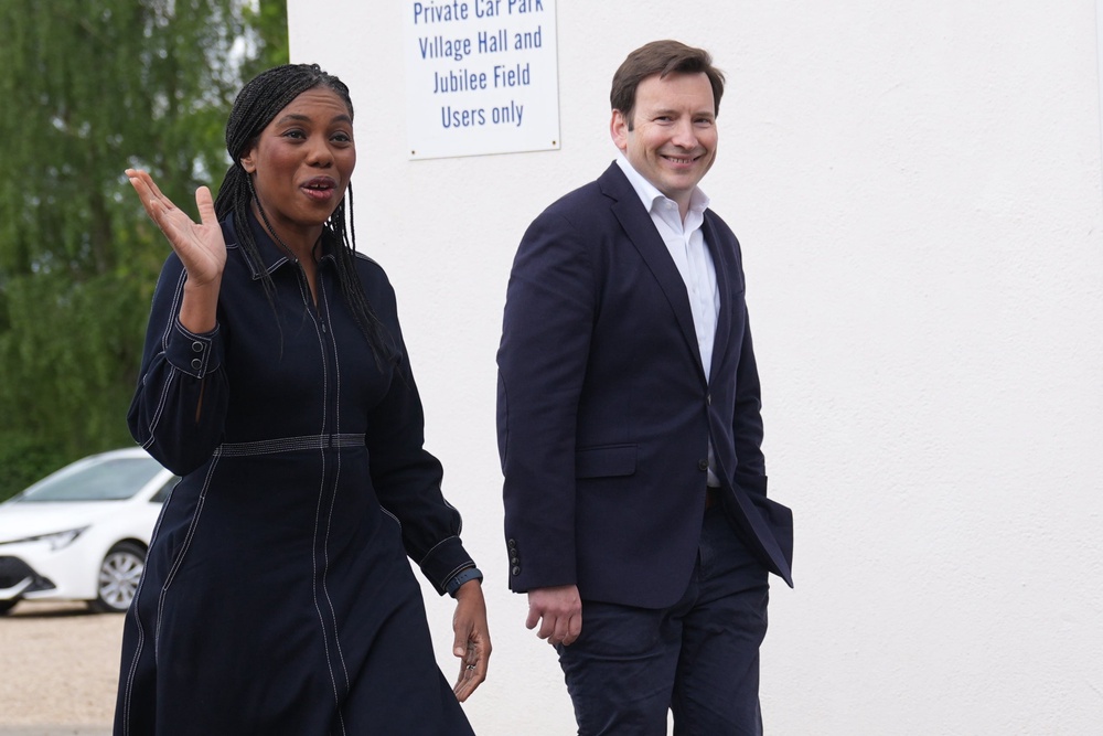 Kemi Badenoch and her husband Hamish Badenoch arrive to cast their votes (PA)