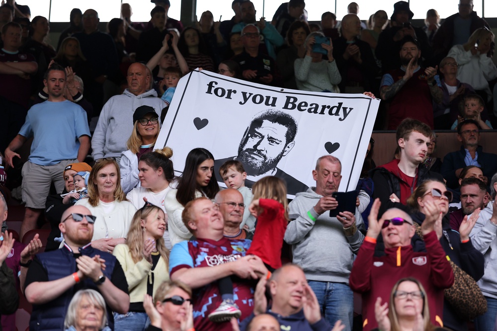 Supporters of Burnley FC hold a banner in memory of Matt Beard during a match between Burnley and Stoke City in April (Getty)