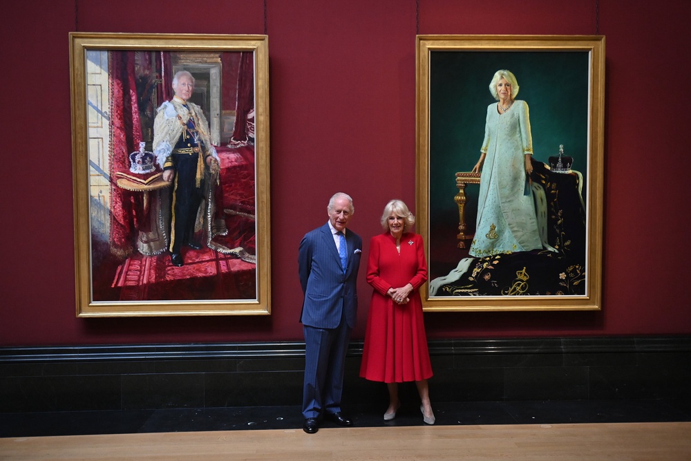 The King and Queen in front of the coronation state portraits in the Central Hall at the National Gallery, London (Eddie Mulholland/Daily Telegraph/PA) (PA Archive)