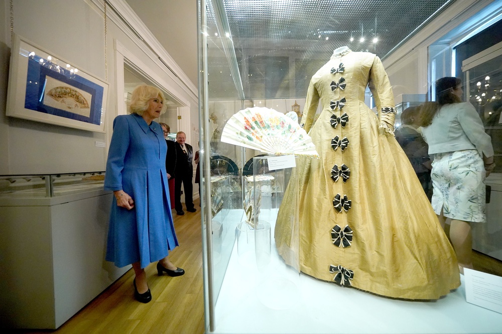 Queen Camilla (left) views exhibits at the opening of the Monarchy exhibition at The Fan Museum (Yui Mok/PA) (PA Wire)