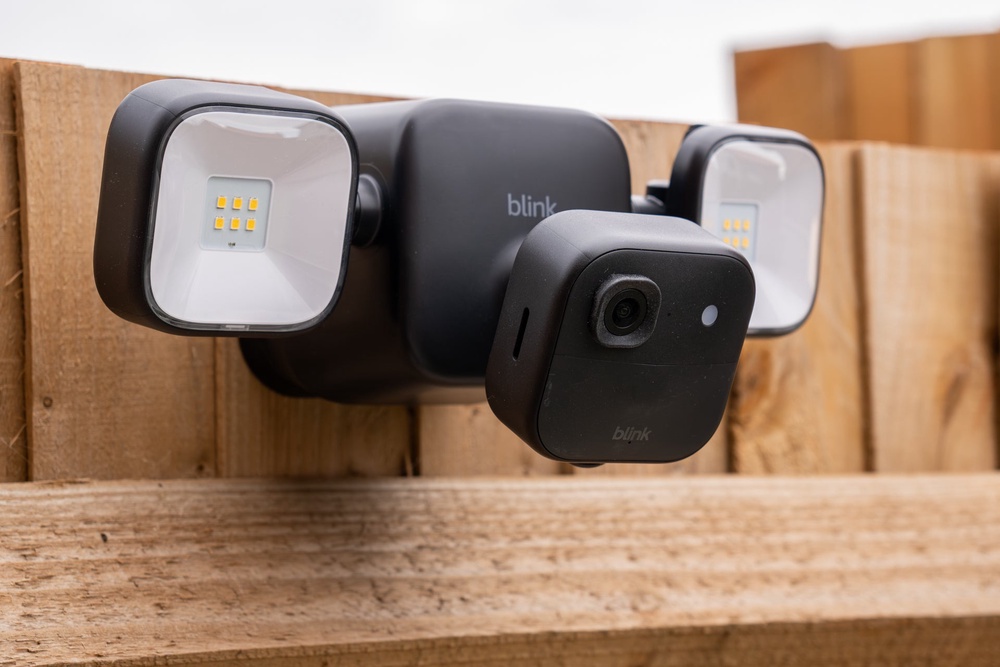 Blink sells a wall mount with integrated, battery-powered LED floodlights for its outdoor camera (The Independent / Alistair Charlton)