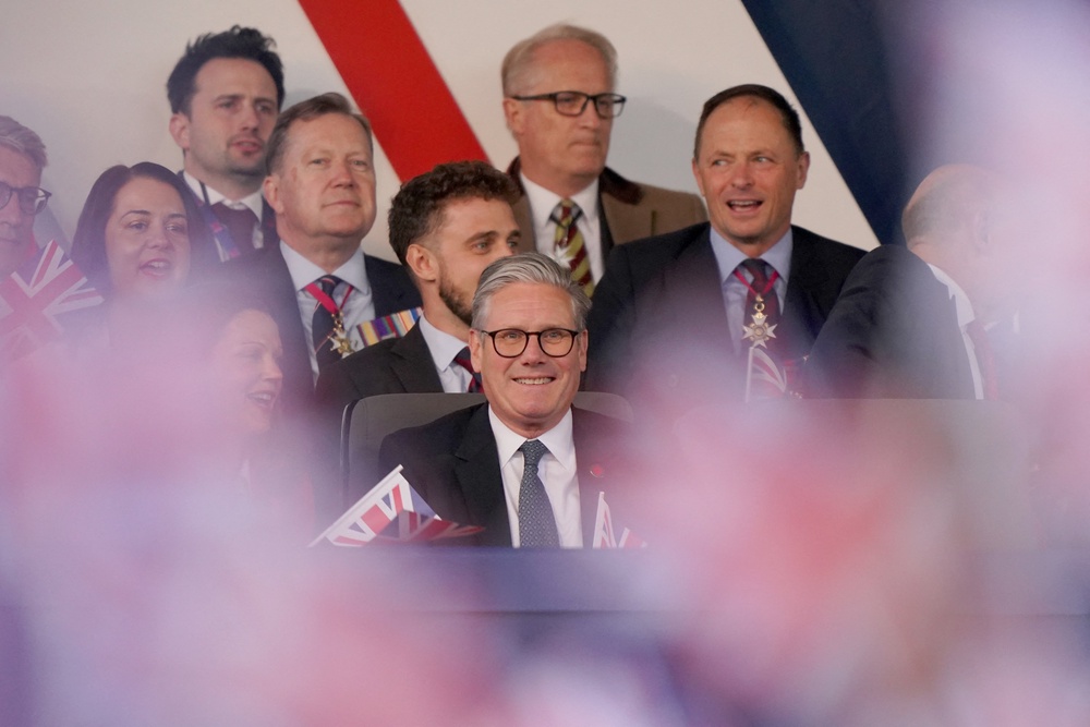 Starmer smiles during a celebratory concert to mark the 80th anniversary of VE Day last year (YUI MOK/POOL/AFP via Getty Images)