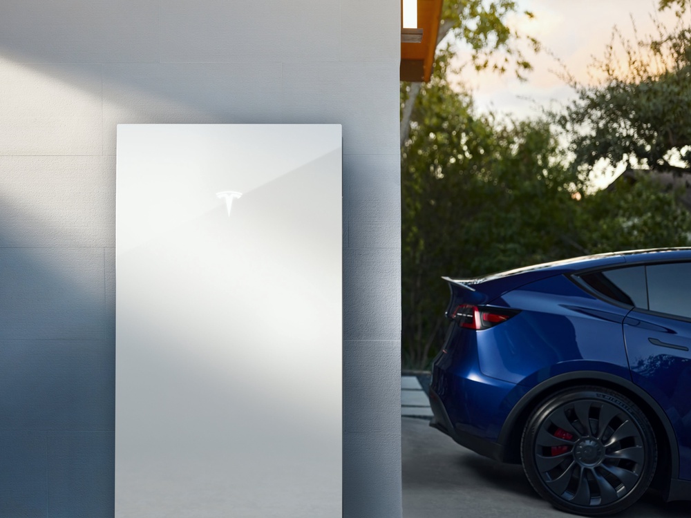 Tesla says a Powerwall combined with solar panels could save owners £1,450 a year in energy costs (Tesla)
