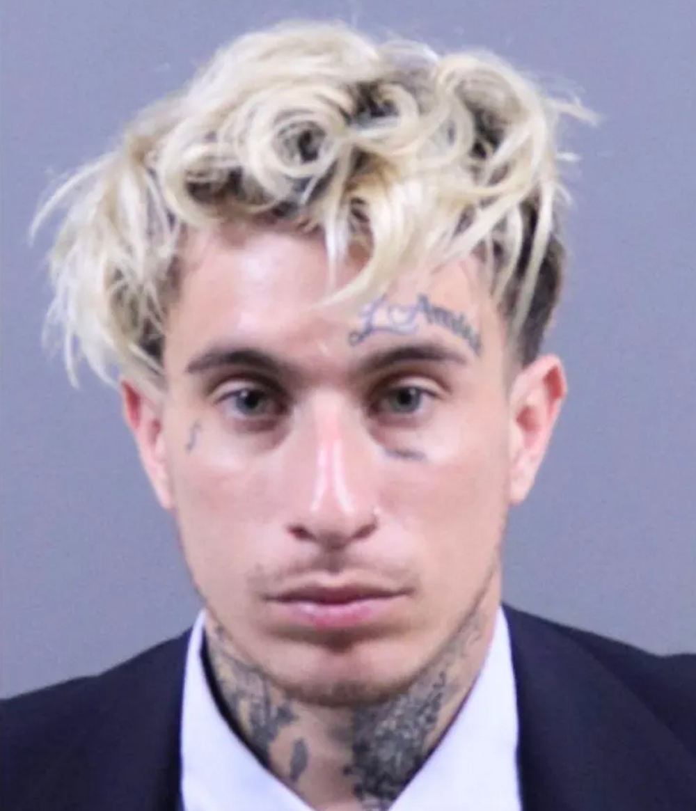 Brandon Holguin, 26, was charged after being accused of trafficking a 14-year-old boy who had been reported missing by family members (Los Angeles County District Attorney’s Office)