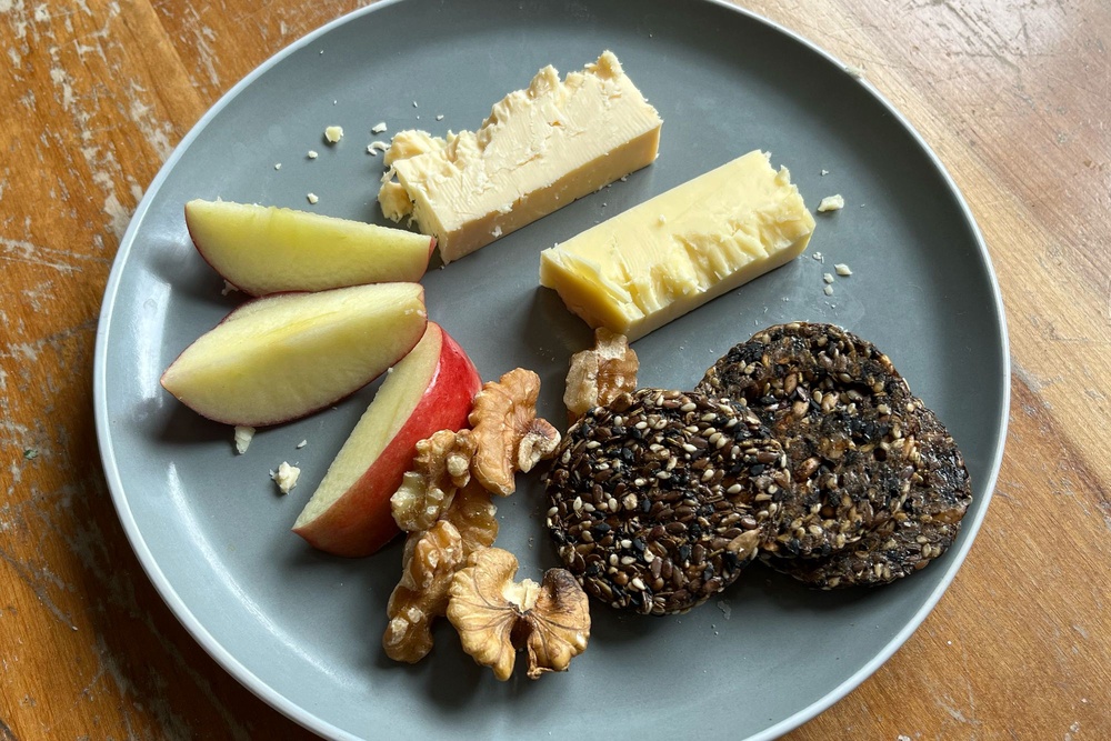 I paired the cheese with crackers and apples (Alice Reynolds/The Independent)