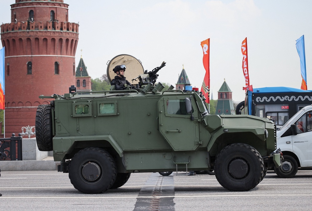A Russian security officer remains atop an all-terrain infantry mobility vehicle amid increased security measures taken ahead of Victory Day in central Moscow (Reuters)