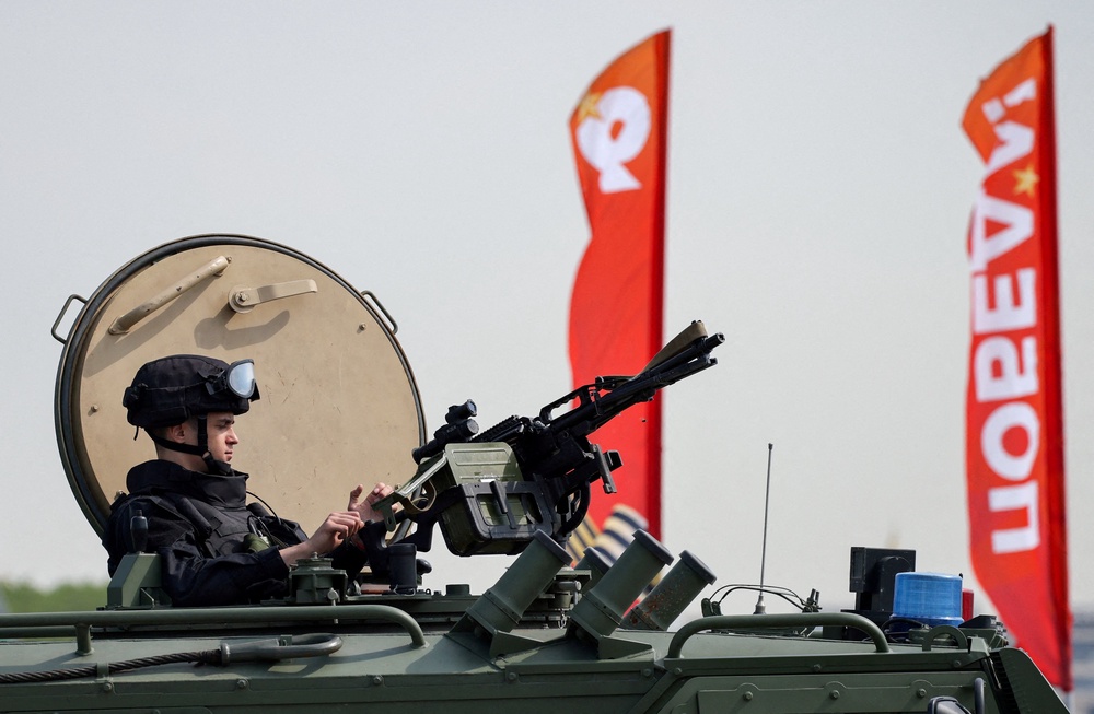 A Russian security officer watches over Red Square from an all-terrain infantry mobility vehicle amid increased security measures taken ahead of Victory Day in Moscow (Reuters)