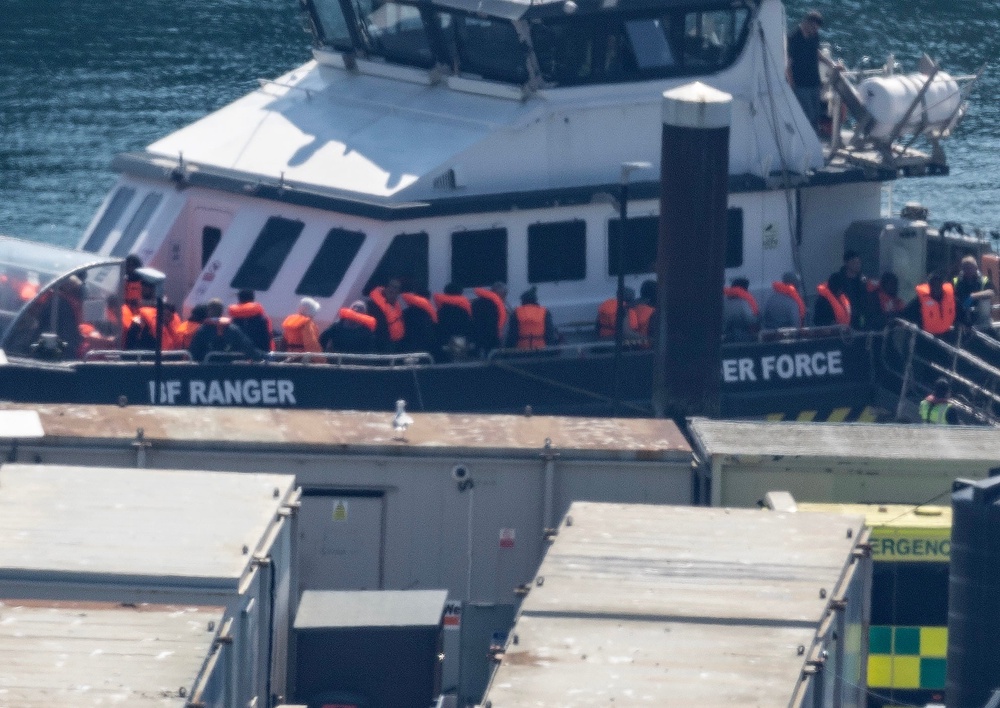 A group of people thought to be migrants are brought in to the Border Security Command compound in Dover following a small boat incident in the Channel (PA)