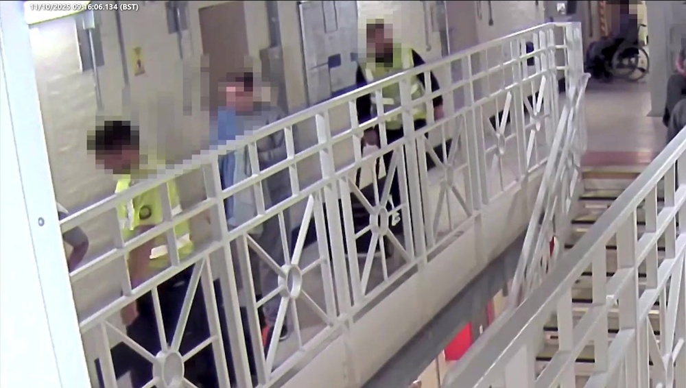 Screen grab taken from CCTV dated 11/10/2025 issued by West Yorkshire Police showing medical help arriving at Ian Watkins' cell after he was attacked at HMP Wakefield. (West Yorkshire Police)