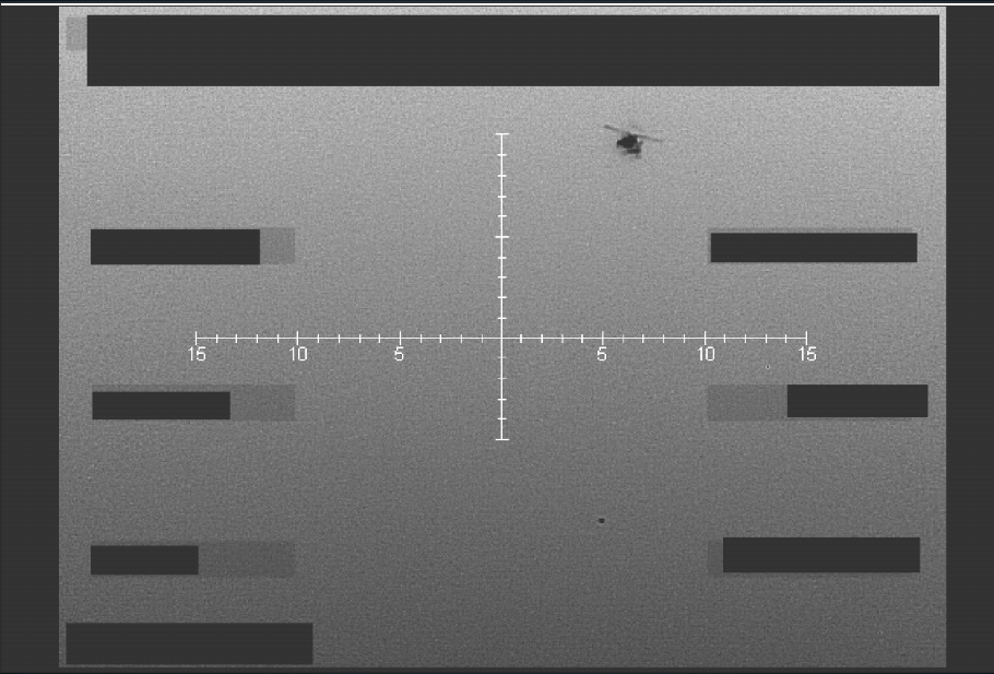 An infrared still image, taken in September 2025, of a helicopter flying over an unidentified object in the western U.S. The image was released Friday as part of the government’s trove of UFO files (Department of Defense)