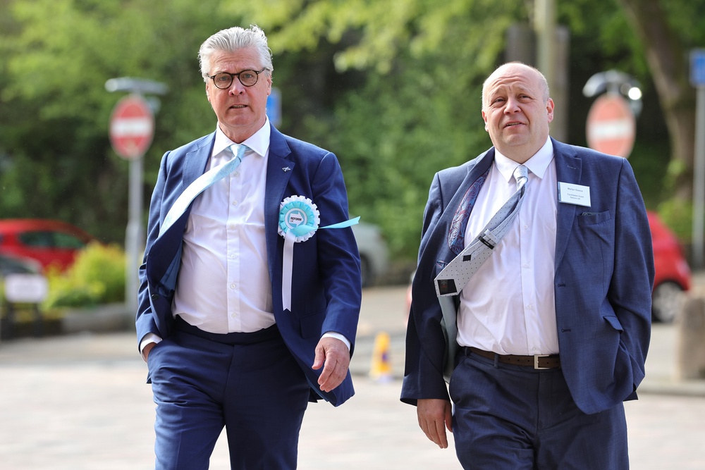 Reform UK Scottish leader Lord Malcolm Offord, left, arrives at the Greenock Town Hall count (Steve Welsh/PA) (PA Wire)