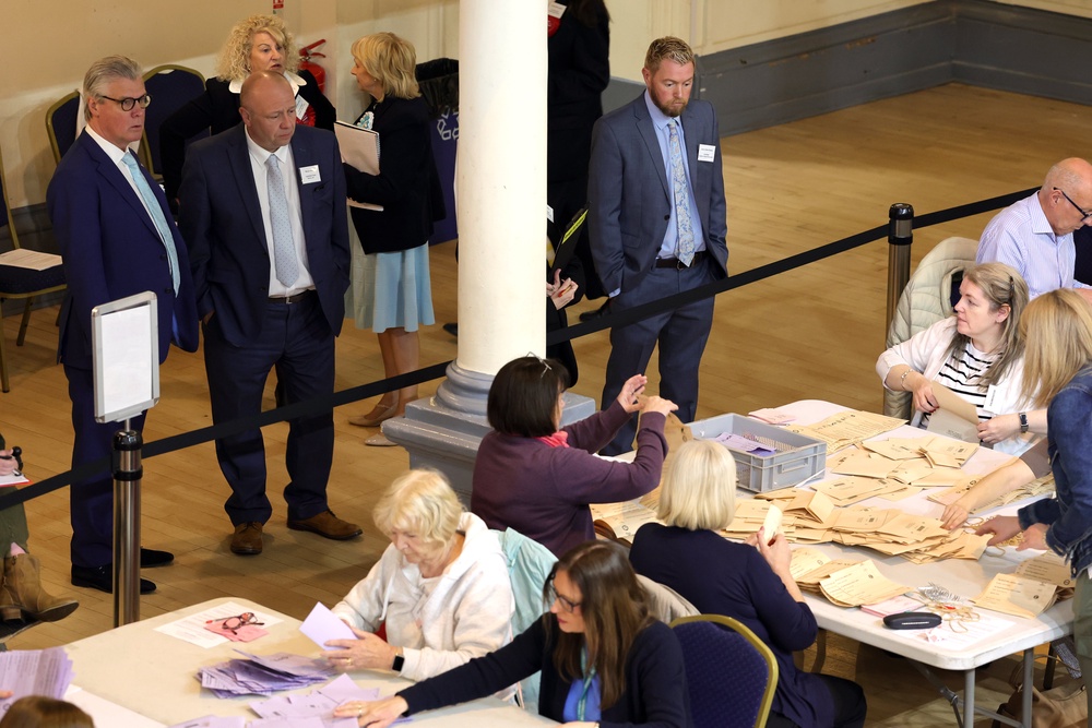 Malcolm Offord, left, looks on as votes are counted at Greenock Town Hall (Steve Welsh/PA) (PA Wire)