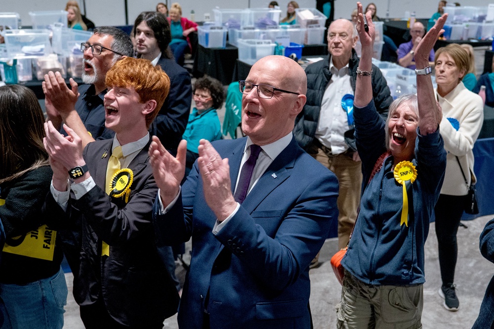 First minister and SNP leader John Swinney with party supporters, at the election count for the 2026 Holyrood elections (PA)