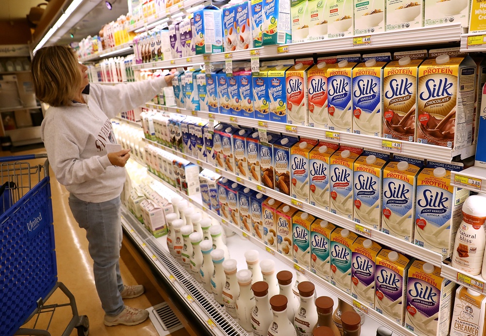 A woman shops for soy milk in Northern California in July 2016. Just a cup of chocolate soy milk has more than half of the daily recommend vitamin B12 for adults (Getty)