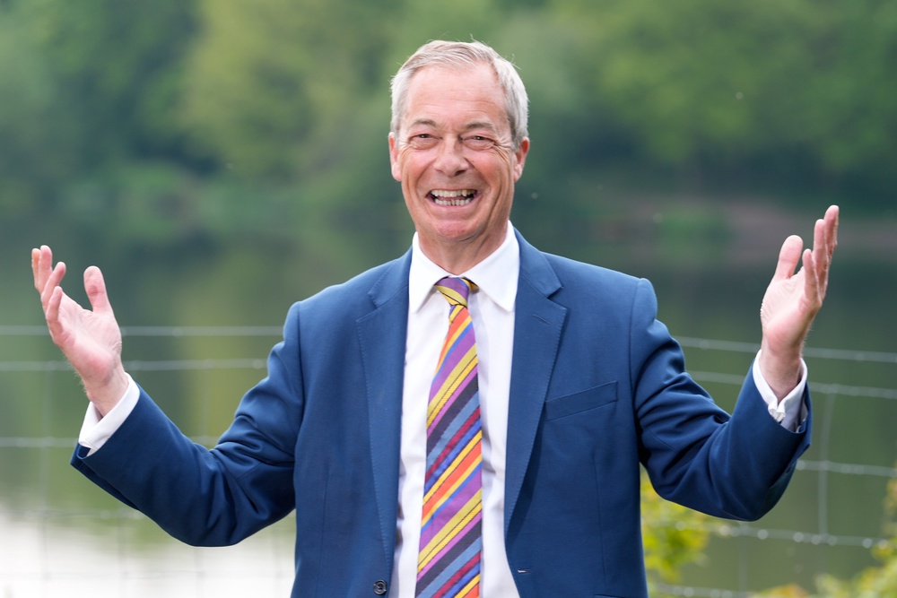 Nigel Farage has celebrated hundreds of gains for Reform (PA)