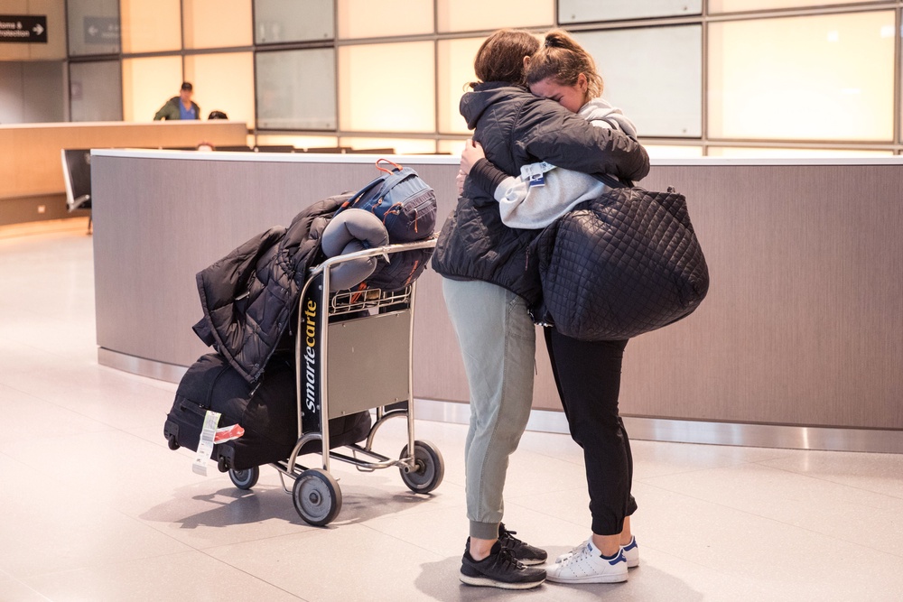 A daughter hugs her mother at Logan Airport in Boston, Massachusetts. People who don’t have voicemails of their mothers can still be comforted through their memory (Getty)
