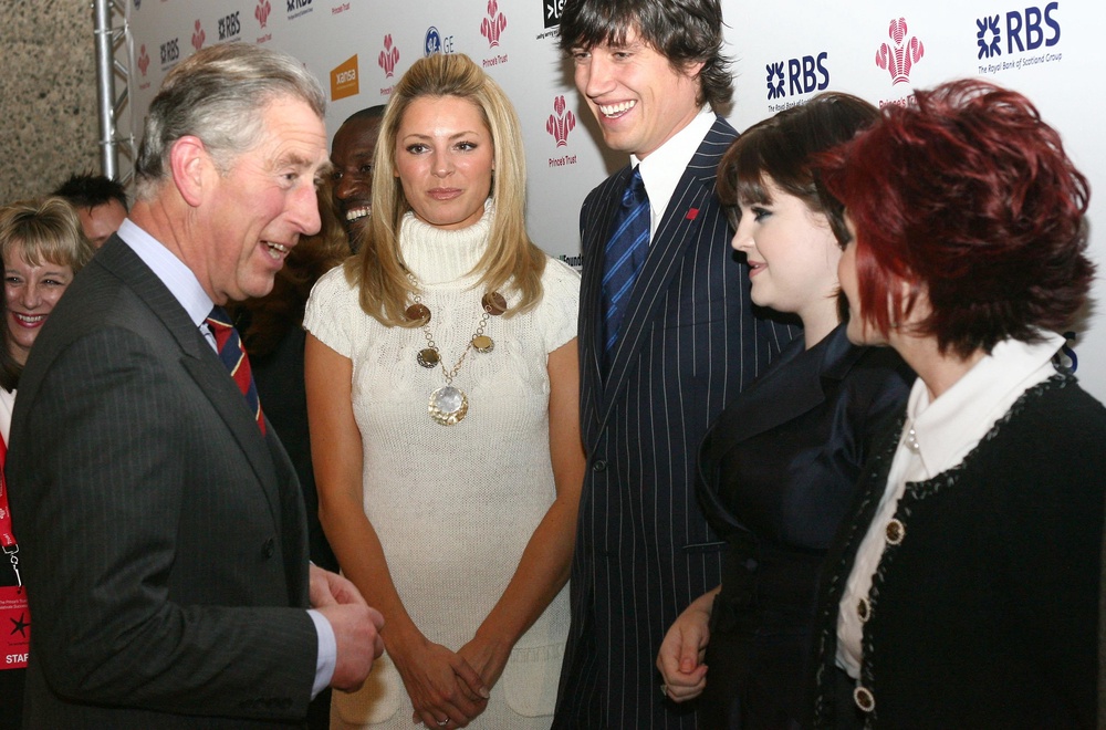 Tess and Vernon look on as the then Prince Charles greets Kelly and Sharon Osbourne at a special Prince’s Trust awards ceremony (PA) (PA Archive)