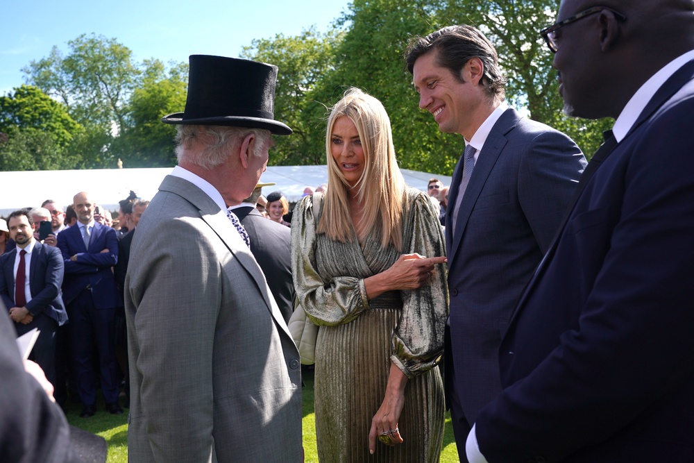 The King speaking with the couple at The Sovereign’s Creative Industries Garden Party (PA) (PA Archive)