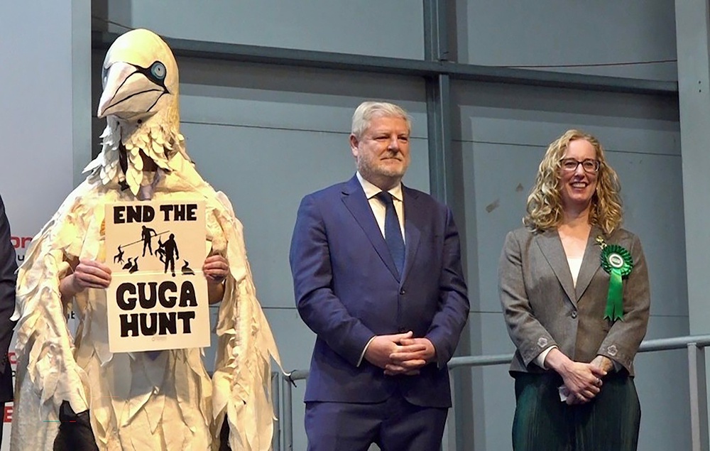SNP campaign director Angus Robertson (centre) was defeated in Edinburgh by Lorna Slater (right) who became the Scottish Greens first ever constituency MSP. (David Young/PA)