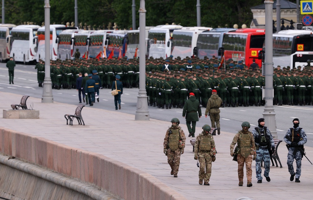Russian security personnel patrol an area before a military parade on Victory Day (Reuters)