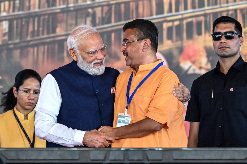 Newly elected Chief Minister of West Bengal state, Suvendu Adhikari greets India's Prime Minister Narendra Modi (AFP/Getty)