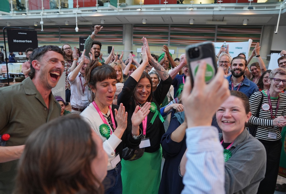 Green Party supporters congratulate candidate Florence Cullen-Davies after she is declared a winner in the 2026 London Borough of Hackney council election (PA)