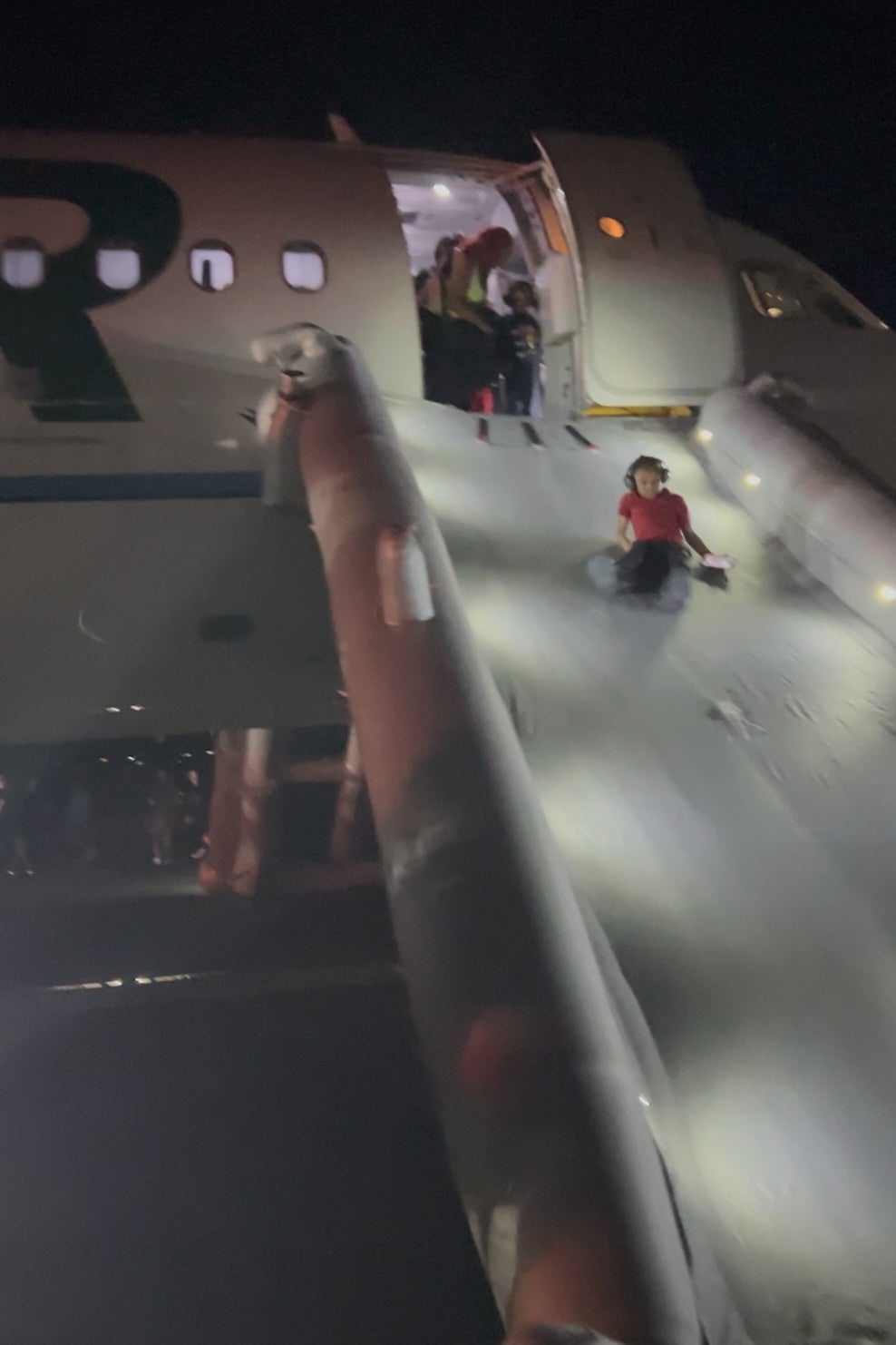 Passengers evacuated onto the runway via an inflatable slide (AP)
