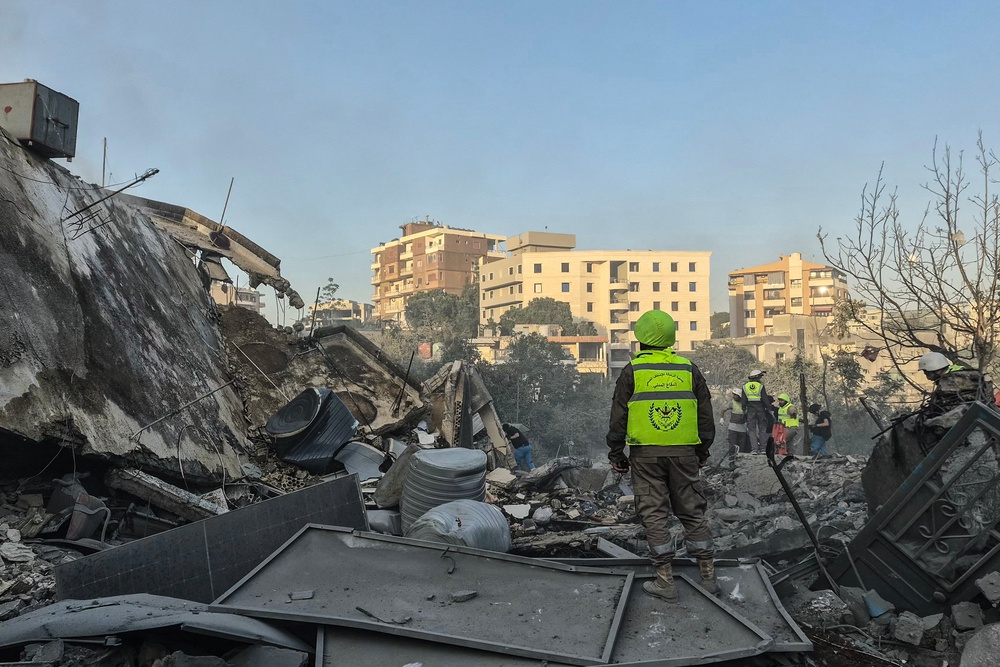 First responders search the rubble for victims at the site of an Israeli airstrike in the southern town of Nabatieh (AFP/Getty)