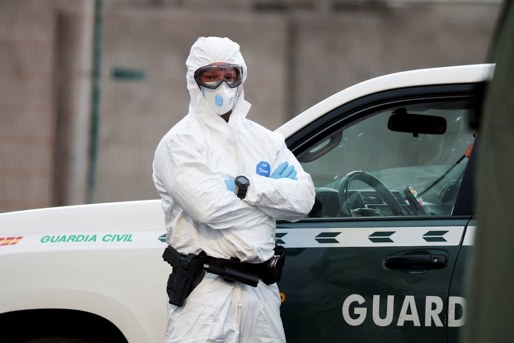 Security officers are dressed in protective clothing (Reuters)