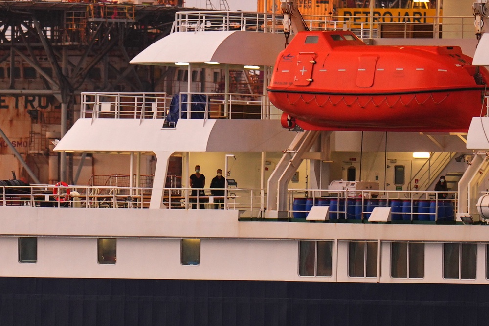 Passengers on board the hantavirus-stricken cruise ship MV Hondius after arriving at the port of Granadilla in Tenerife on Sunday (Manu Fernandez/AP) (AP)
