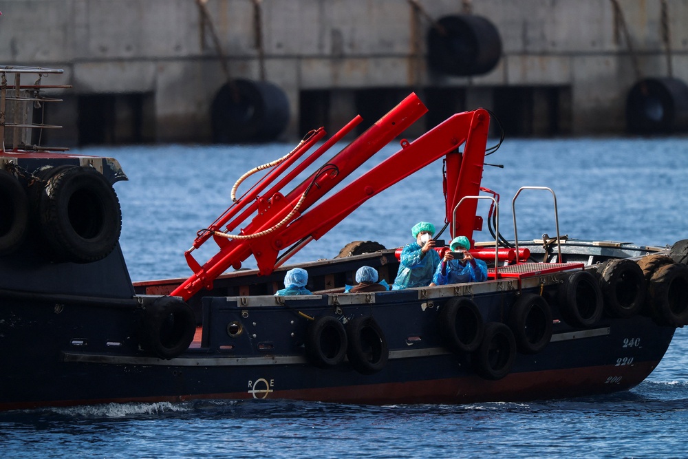 People from the cruise ship MV Hondius, affected by a hantavirus outbreak, are transferred by boat to the port after disembarking (Reuters)