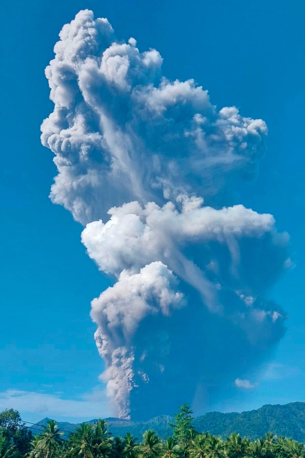Mount Dukono releases volcanic materials during an eruption in North Halmahera, Indonesia (AP)