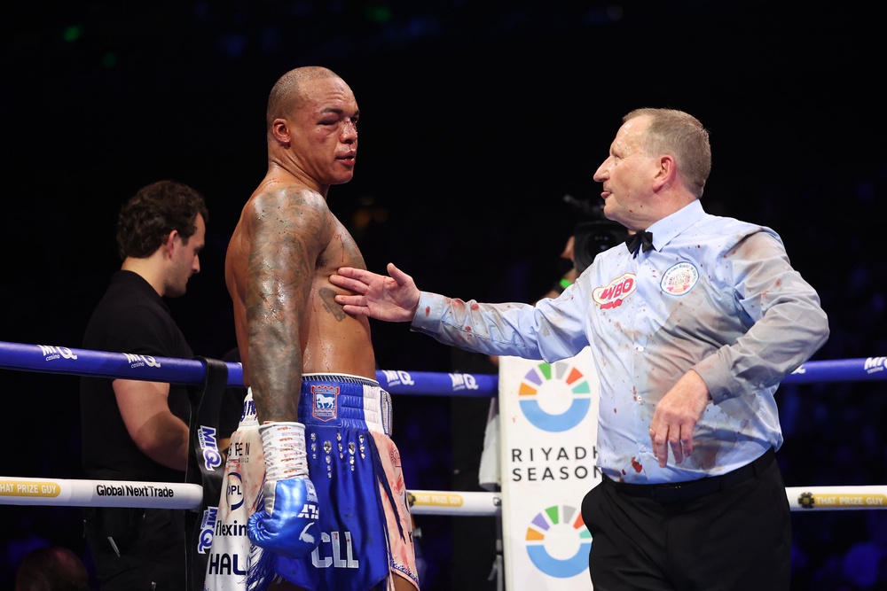 A ringside doctor (left) and referee Howard Foster checked on Wardley before rounds nine and 10 (Getty)
