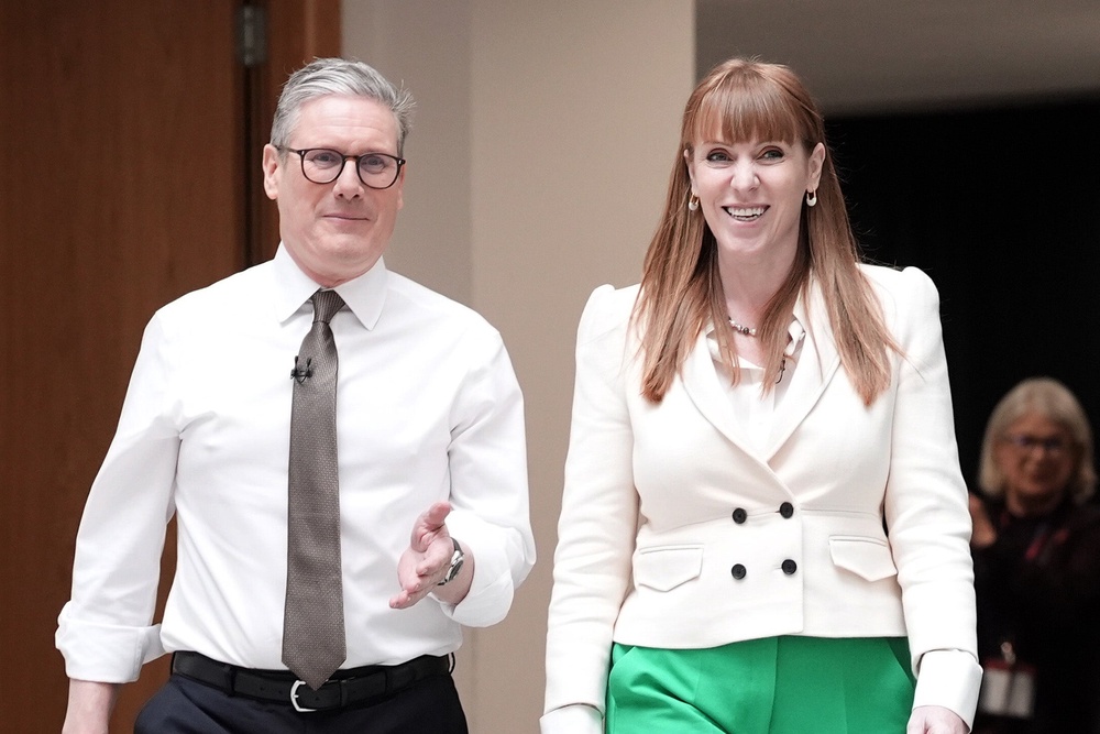 Sir Keir Starmer with Angela Rayner in 2024, before being voted into government (PA)