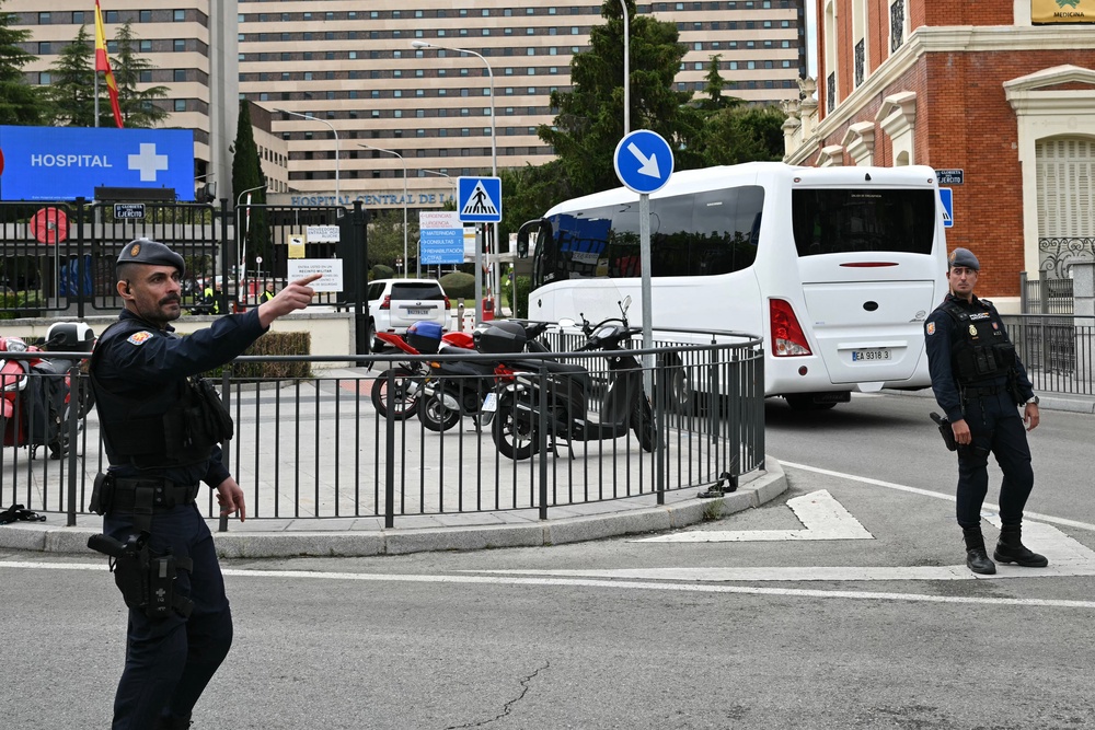 Police helped to escort the bus into the hospital (AFP/Getty)