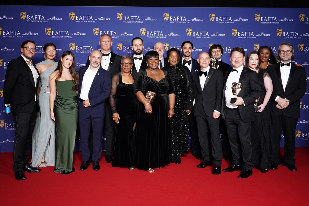 Winners of the single documentary award for ‘Grenfell: Uncovered’ (PA)