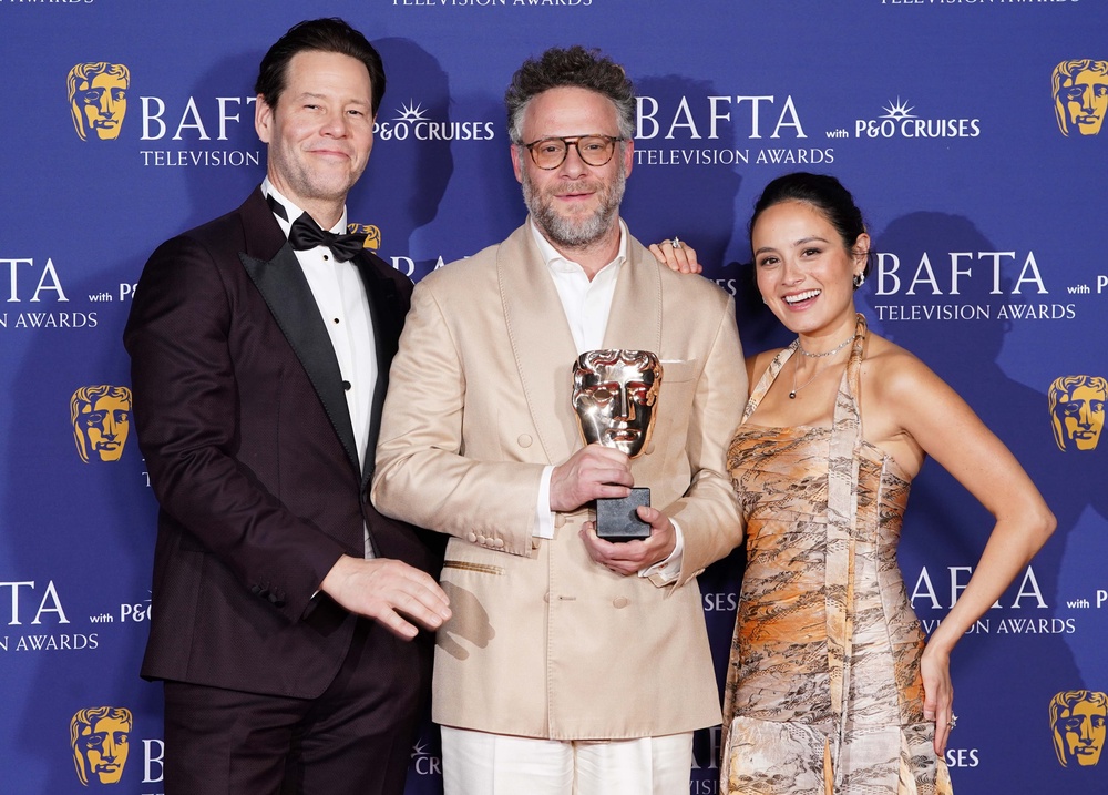 Ike Barinholtz, Seth Rogen and Chase Sui Wonders, winners of the International Award for 'The Studio' (PA)